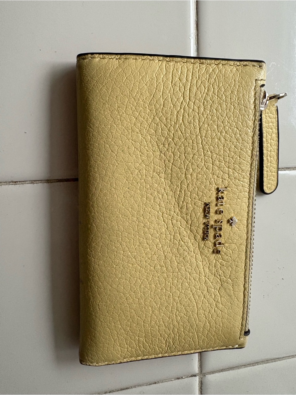 kate spade Pebble Leather Zip Wallet in Soft Yellow